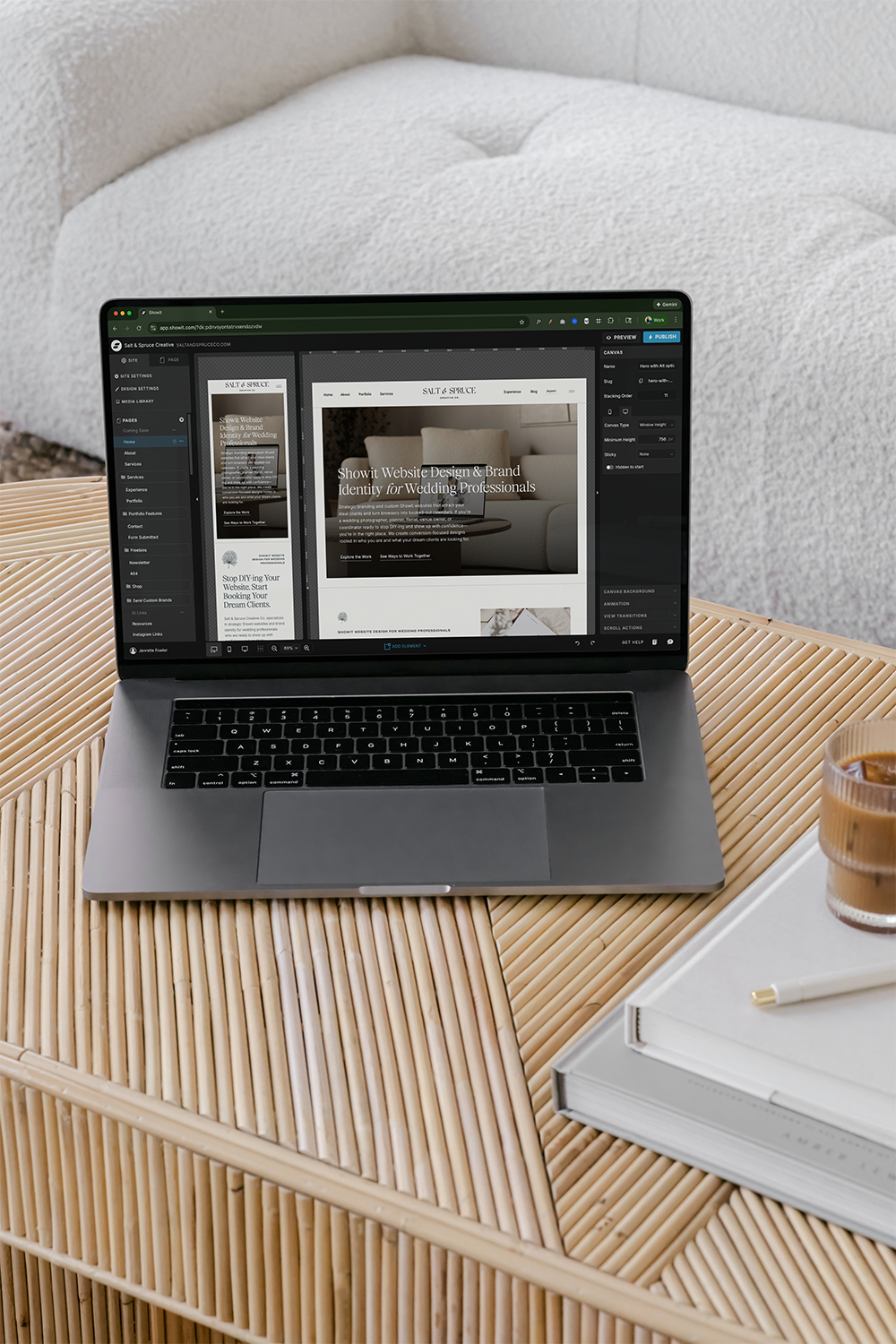 Wedding photographer working on Showit website design on laptop with mood board and coffee.